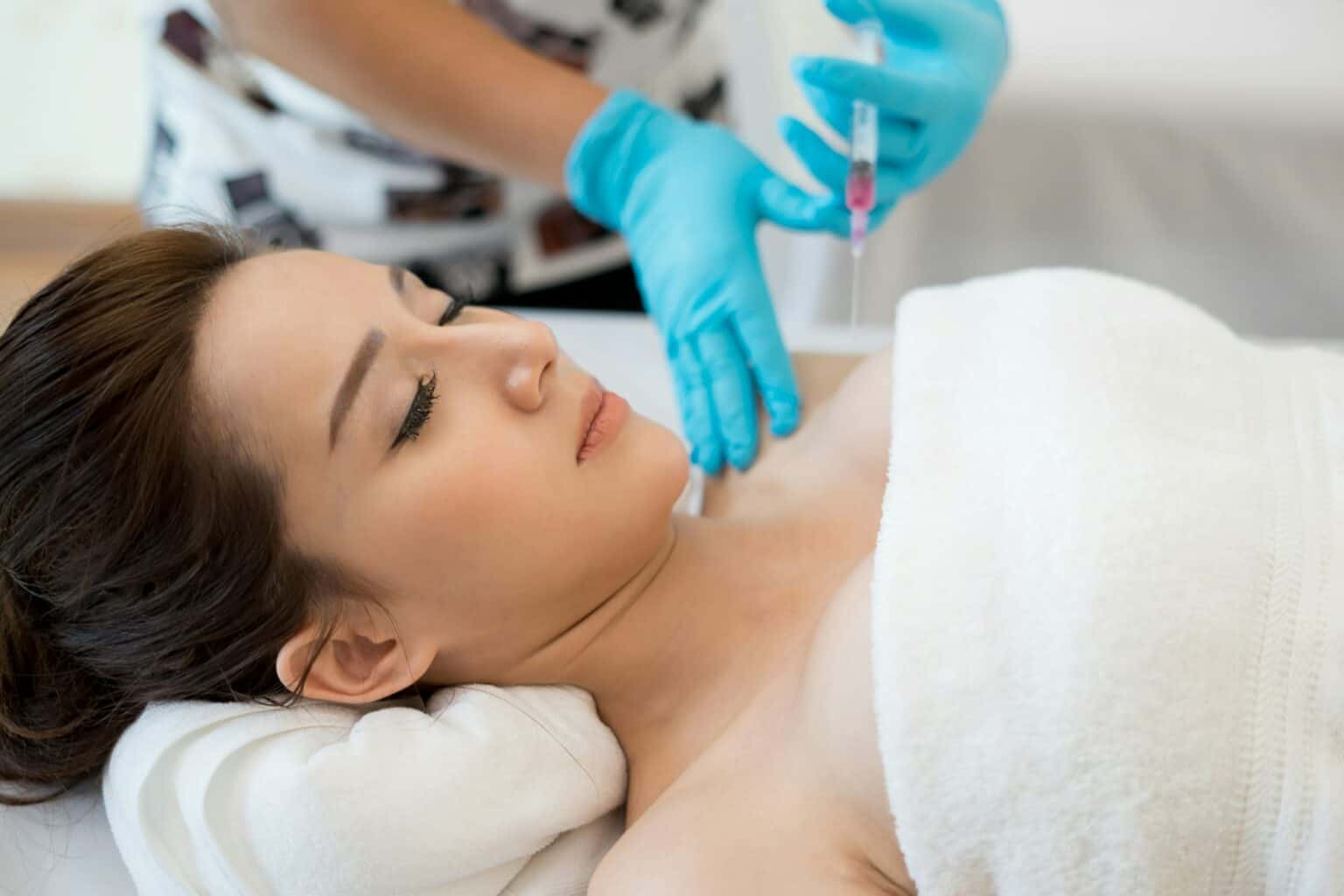 Surgery cosmetology inject botox in breast.