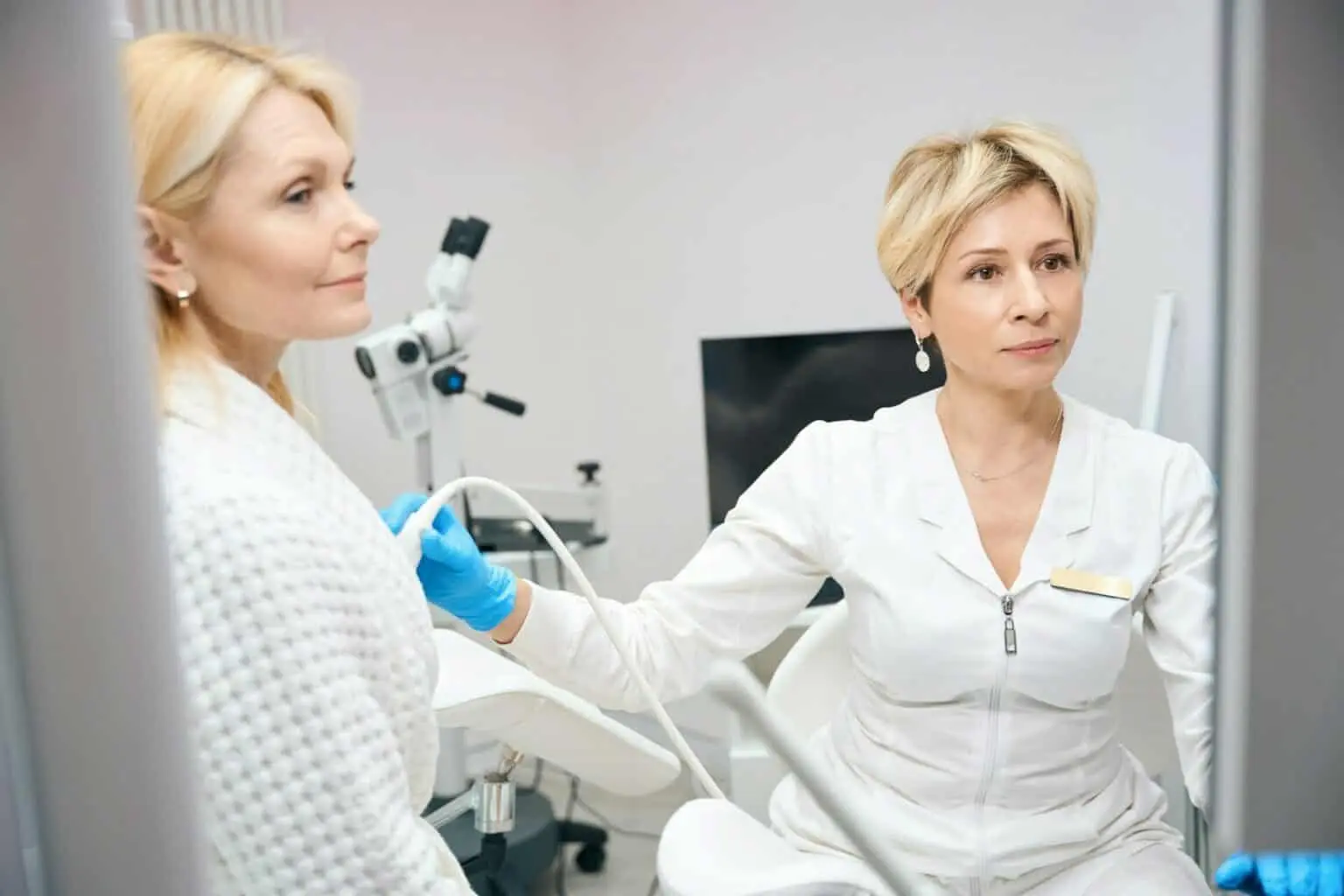 Doctor consulting patient in medical office.